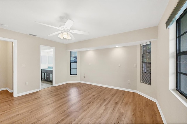 408 Fletcher St, Port Charlotte, FL 33954 - empty room featuring light wood-style flooring, baseboards, and a ceiling fan