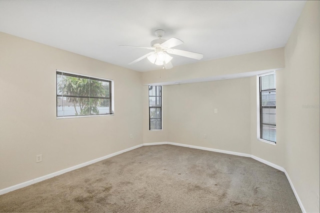 408 Fletcher St, Port Charlotte, FL 33954 - carpeted empty room featuring baseboards and ceiling fan