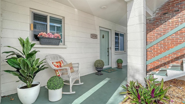 1838 Restful Dr Unit K-1, Bradenton, FL 34207 - view of exterior entry with brick siding and a porch