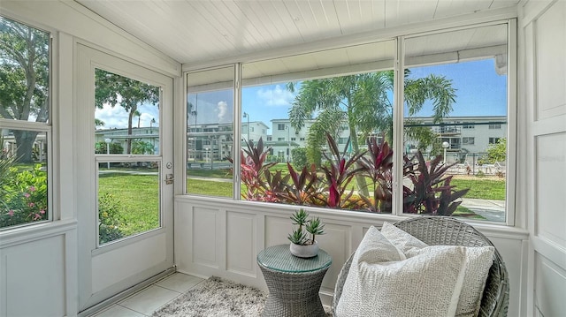 1838 Restful Dr Unit K-1, Bradenton, FL 34207 - sunroom / solarium featuring tile patterned floors and a decorative wall