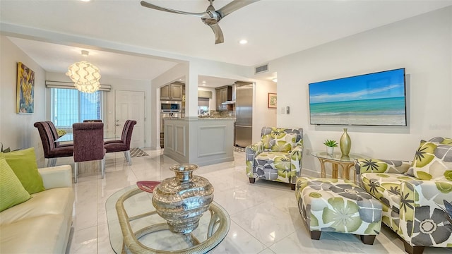 1838 Restful Dr Unit K-1, Bradenton, FL 34207 - living room featuring a ceiling fan, baseboards, recessed lighting, and a chandelier