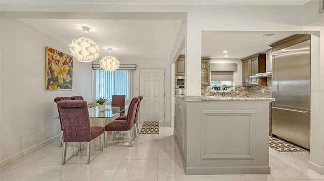 1838 Restful Dr Unit K-1, Bradenton, FL 34207 - dining space featuring light marble finish flooring, baseboards, and plenty of natural light