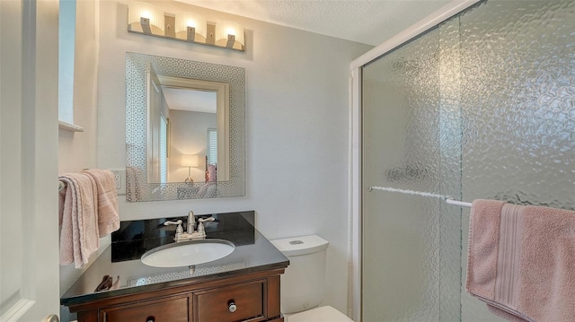 1838 Restful Dr Unit K-1, Bradenton, FL 34207 - bathroom with vanity, a stall shower, and toilet