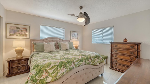 1838 Restful Dr Unit K-1, Bradenton, FL 34207 - bedroom featuring multiple windows, ceiling fan, and a textured ceiling