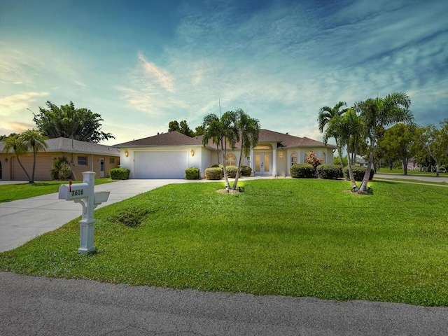 3616 SE 8th Pl, Cape Coral, FL 33904 - ranch-style house featuring french doors, driveway, a garage, a front lawn, and stucco siding