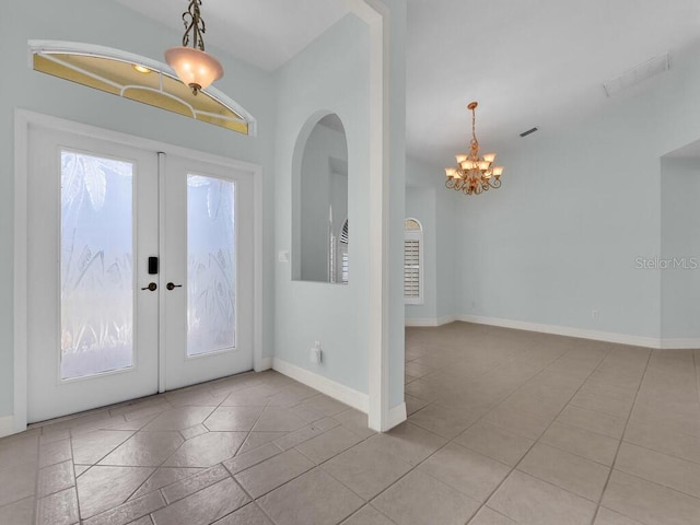 3616 SE 8th Pl, Cape Coral, FL 33904 - tiled entryway featuring a chandelier, french doors, and baseboards