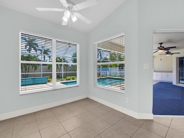 3616 SE 8th Pl, Cape Coral, FL 33904 - tiled spare room featuring a ceiling fan, vaulted ceiling, and baseboards