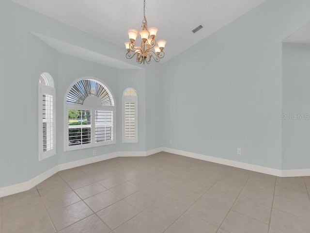 3616 SE 8th Pl, Cape Coral, FL 33904 - tiled empty room with a chandelier, vaulted ceiling, and baseboards