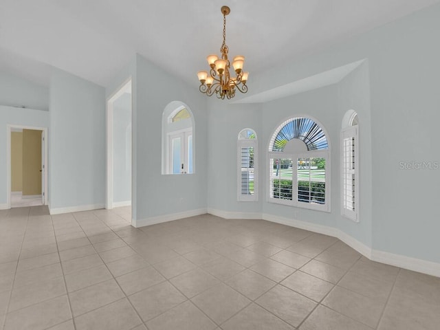 3616 SE 8th Pl, Cape Coral, FL 33904 - spare room with light tile patterned floors, a chandelier, and baseboards