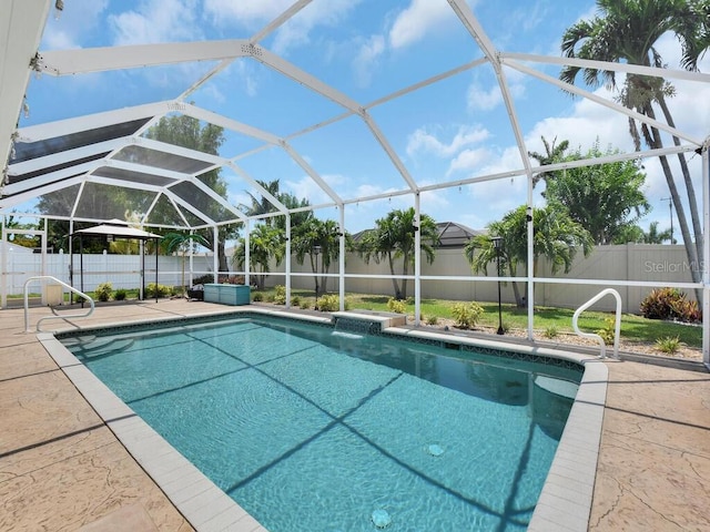 3616 SE 8th Pl, Cape Coral, FL 33904 - view of swimming pool featuring a fenced backyard, a patio, and glass enclosure