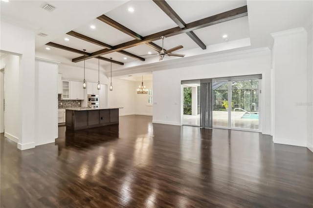 1015 143rd St NE, Bradenton, FL 34212 - unfurnished living room featuring baseboards, a chandelier, dark wood-style flooring, beamed ceiling, and a ceiling fan