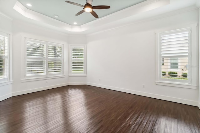 1015 143rd St NE, Bradenton, FL 34212 - empty room featuring ornamental molding, a raised ceiling, ceiling fan, dark wood-type flooring, and baseboards