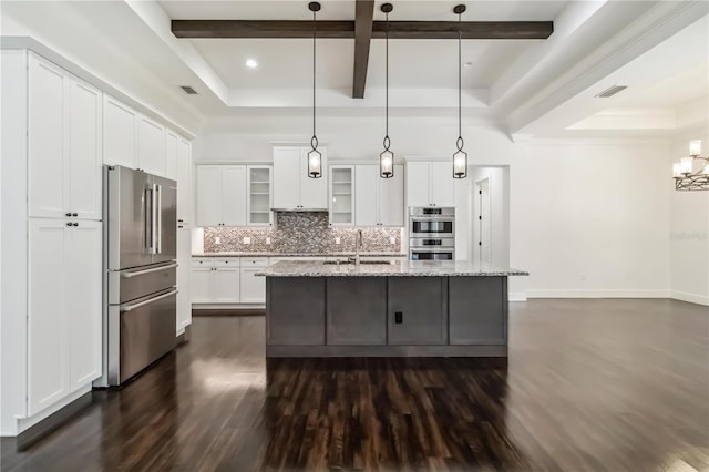 1015 143rd St NE, Bradenton, FL 34212 - kitchen with appliances with stainless steel finishes, dark wood-style floors, backsplash, a sink, and glass insert cabinets
