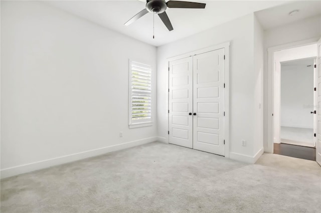 1015 143rd St NE, Bradenton, FL 34212 - unfurnished bedroom with baseboards, carpet flooring, a closet, and a ceiling fan