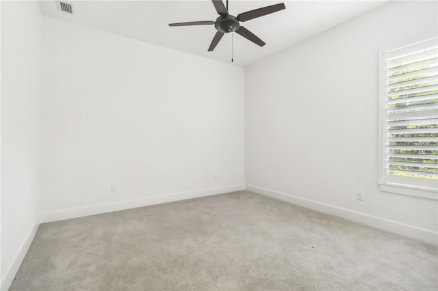 1015 143rd St NE, Bradenton, FL 34212 - spare room with light colored carpet, a ceiling fan, and baseboards