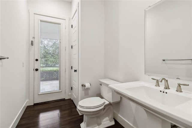 1015 143rd St NE, Bradenton, FL 34212 - half bath featuring wood finished floors, toilet, and baseboards