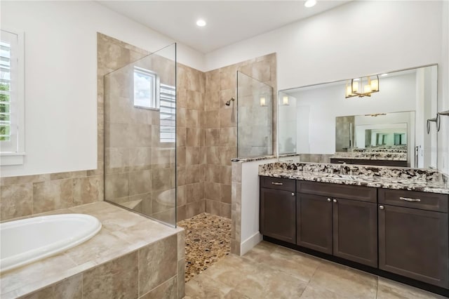 1015 143rd St NE, Bradenton, FL 34212 - full bathroom with a garden tub, a walk in shower, vanity, tile patterned floors, and recessed lighting