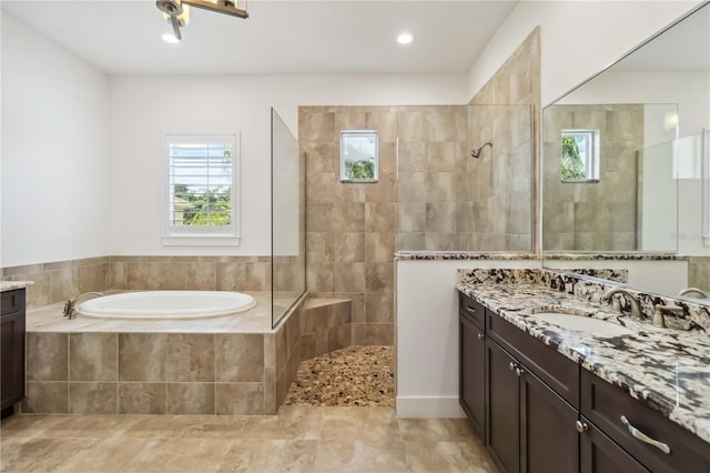 1015 143rd St NE, Bradenton, FL 34212 - full bathroom with plenty of natural light, vanity, a garden tub, and walk in shower