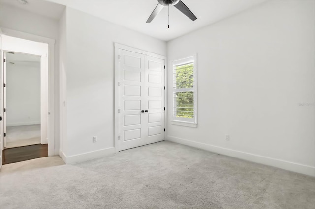1015 143rd St NE, Bradenton, FL 34212 - unfurnished bedroom featuring carpet floors, baseboards, a ceiling fan, and a closet