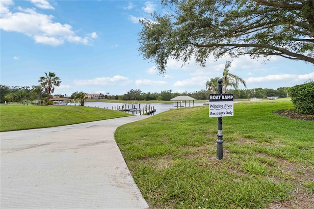 1015 143rd St NE, Bradenton, FL 34212 - view of home's community featuring a lawn, a water view, and a dock