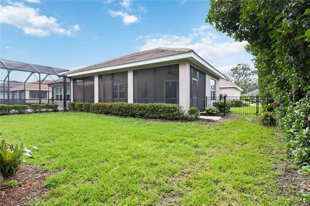 1015 143rd St NE, Bradenton, FL 34212 - rear view of property featuring stucco siding, ceiling fan, and a sunroom