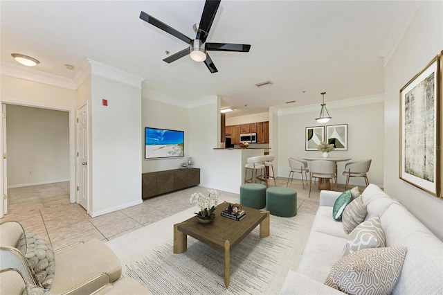 4802 51st St W Unit 808, Bradenton, FL 34210 - living area with crown molding, light tile patterned floors, ceiling fan, and baseboards