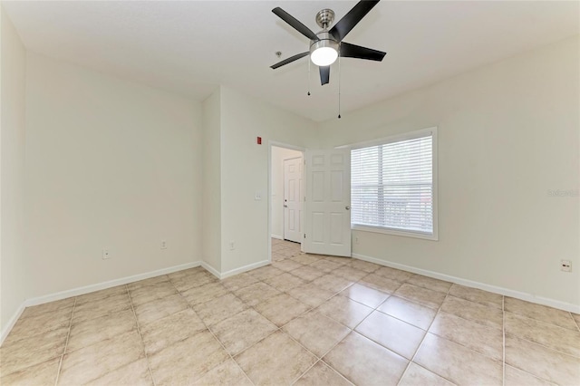 4802 51st St W Unit 808, Bradenton, FL 34210 - tiled spare room with a ceiling fan and baseboards