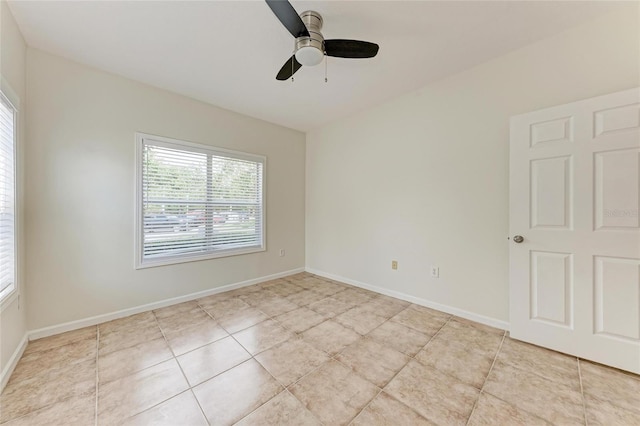 4802 51st St W Unit 808, Bradenton, FL 34210 - empty room featuring light tile patterned floors, a ceiling fan, and baseboards