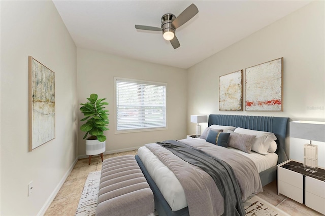 4802 51st St W Unit 808, Bradenton, FL 34210 - bedroom with light tile patterned floors, ceiling fan, and baseboards