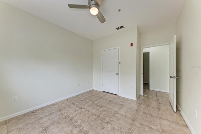 4802 51st St W Unit 808, Bradenton, FL 34210 - unfurnished bedroom with light tile patterned floors, ceiling fan, and baseboards