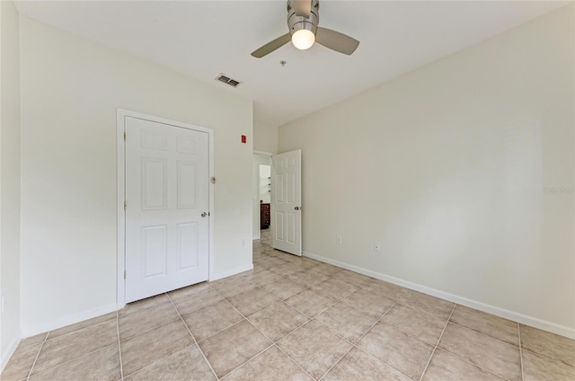 4802 51st St W Unit 808, Bradenton, FL 34210 - empty room with light tile patterned floors, a ceiling fan, and baseboards