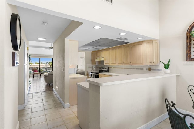 4210 SE 20th Pl Unit A8, Cape Coral, FL 33904 - kitchen featuring stainless steel range with electric cooktop, light brown cabinets, light countertops, light tile patterned floors, and recessed lighting