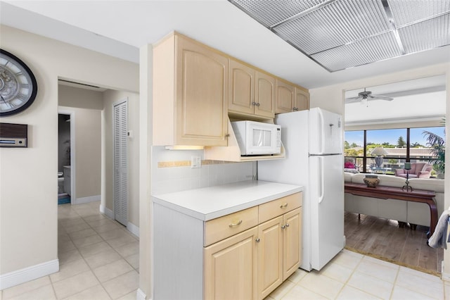 4210 SE 20th Pl Unit A8, Cape Coral, FL 33904 - kitchen with white appliances, light brown cabinetry, light countertops, backsplash, and a ceiling fan