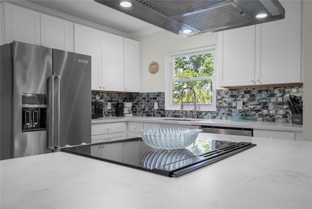 3861 N Ringdove Pt, Crystal River, FL 34428 - kitchen with stainless steel appliances, ventilation hood, a sink, and white cabinets