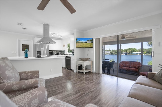 3861 N Ringdove Pt, Crystal River, FL 34428 - living area with ceiling fan, dark wood-style floors, and crown molding