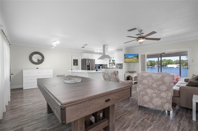 3861 N Ringdove Pt, Crystal River, FL 34428 - game room with crown molding, ceiling fan, dark wood-type flooring, baseboards, and a fireplace