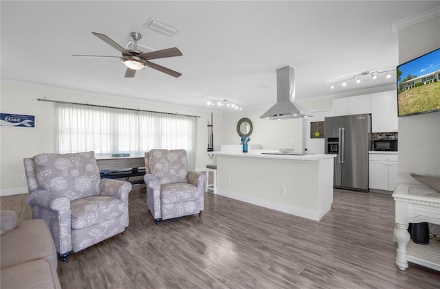 3861 N Ringdove Pt, Crystal River, FL 34428 - living room with wood finished floors, ceiling fan, ornamental molding, baseboards, and track lighting