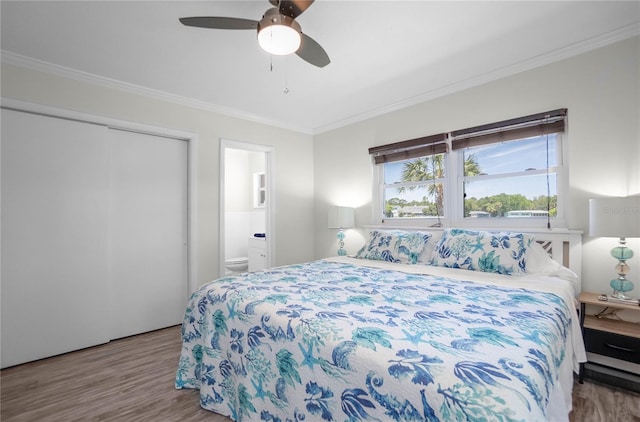 3861 N Ringdove Pt, Crystal River, FL 34428 - bedroom featuring crown molding, wood finished floors, ensuite bathroom, and ceiling fan
