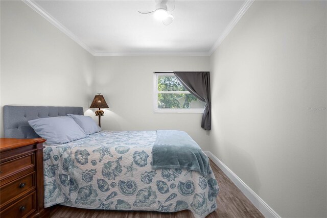3861 N Ringdove Pt, Crystal River, FL 34428 - bedroom with dark wood-type flooring, baseboards, and crown molding