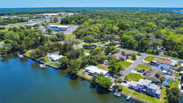 3861 N Ringdove Pt, Crystal River, FL 34428 - aerial perspective of suburban area with a nearby body of water and a heavily wooded area