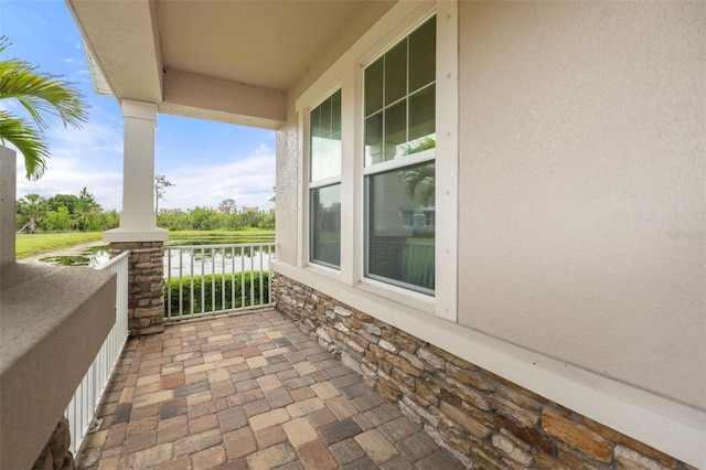 5240 Bentgrass Way, Bradenton, FL 34211 - covered porch featuring a water view