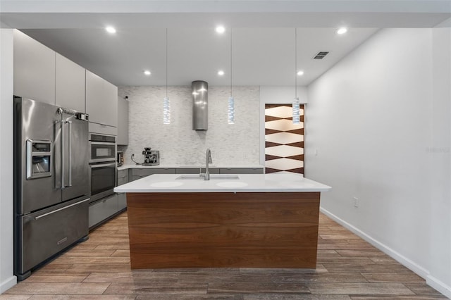 5240 Bentgrass Way, Bradenton, FL 34211 - kitchen featuring stainless steel appliances, a sink, tasteful backsplash, light countertops, and recessed lighting