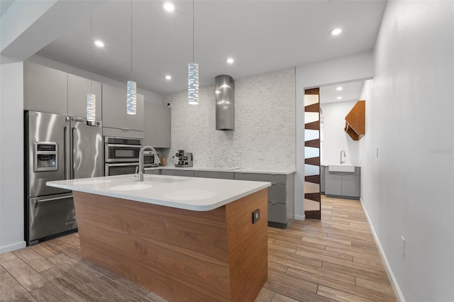 5240 Bentgrass Way, Bradenton, FL 34211 - kitchen with appliances with stainless steel finishes, gray cabinets, a sink, modern cabinets, and recessed lighting