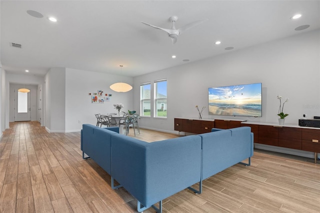 5240 Bentgrass Way, Bradenton, FL 34211 - living room with light wood finished floors, a ceiling fan, recessed lighting, and baseboards
