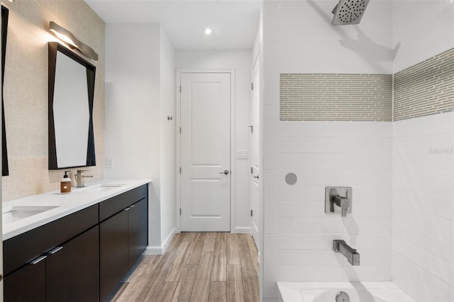 5240 Bentgrass Way, Bradenton, FL 34211 - full bathroom featuring wood finished floors, double vanity,  shower combination, recessed lighting, and baseboards
