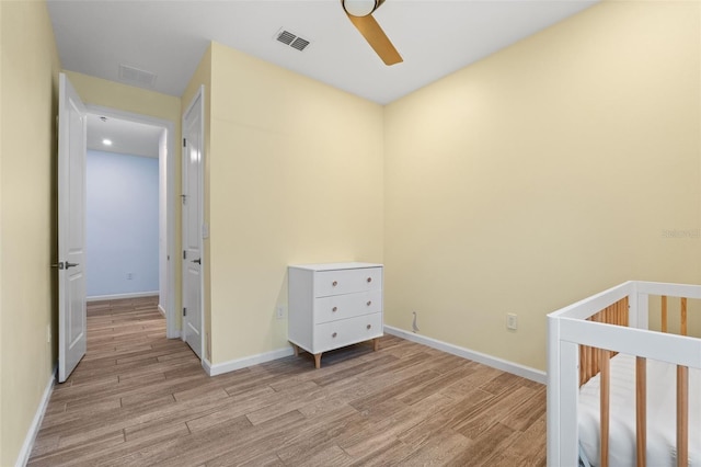 5240 Bentgrass Way, Bradenton, FL 34211 - bedroom featuring light wood finished floors, baseboards, and a ceiling fan