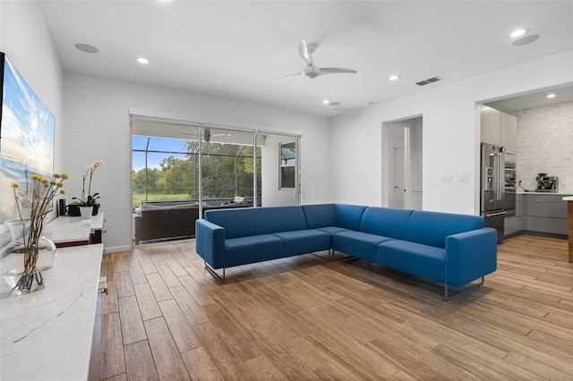 5240 Bentgrass Way, Bradenton, FL 34211 - living area featuring light wood-style flooring, ceiling fan, recessed lighting, and baseboards