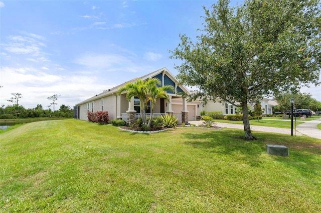 5240 Bentgrass Way, Bradenton, FL 34211 - view of front of home with stucco siding, a front yard, driveway, and a garage