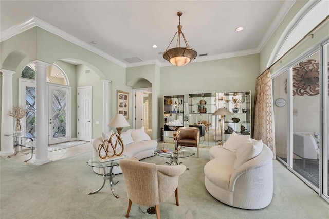 7214 Marlow Pl, University Park, FL 34201 - carpeted living area featuring decorative columns, plenty of natural light, arched walkways, crown molding, and recessed lighting
