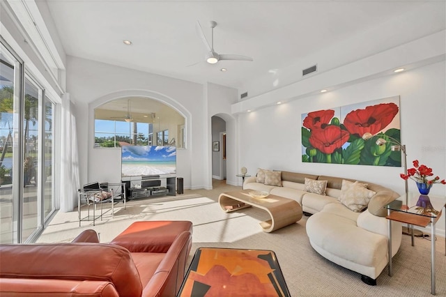 7214 Marlow Pl, University Park, FL 34201 - living area with arched walkways, a ceiling fan, carpet, and recessed lighting